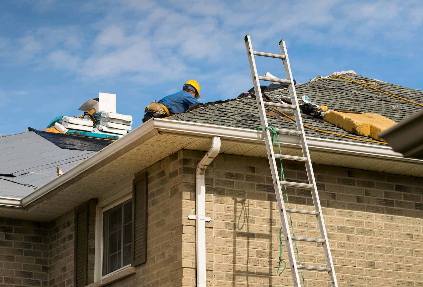 Roofing Solutions of Texas Working on Roof Shingles